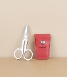 French folding scissors, red leather case