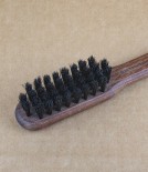 Oiled walnut hand stitched beard brush