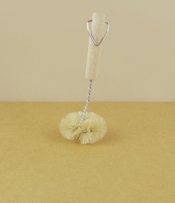 Twisted wire and natural bristle sink brush