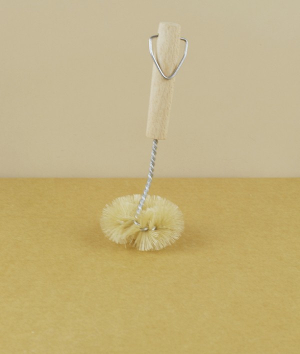 Twisted wire and natural bristle sink brush