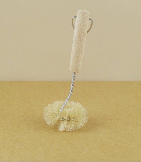 Twisted wire and natural bristle sink brush
