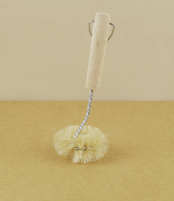 Twisted wire and natural bristle sink brush