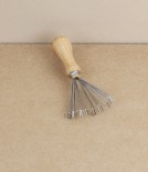 Brush and comb cleaning rake