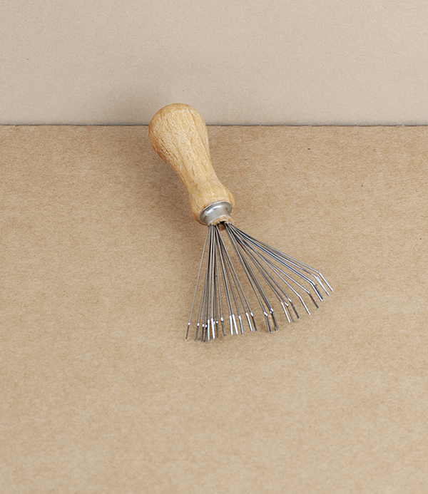 Brush and comb cleaning rake