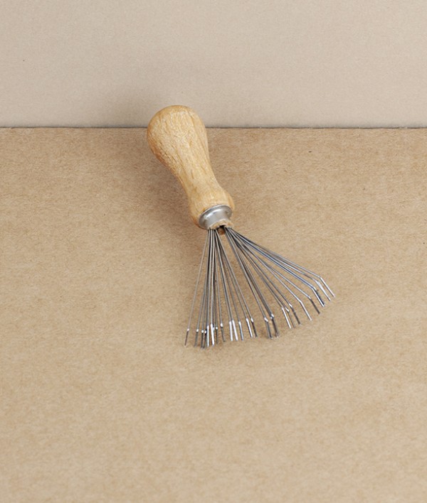 Brush and comb cleaning rake